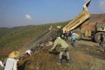 Workers are pictured in Hpakant, Kachin State on December 27, 2015, near the site of a landslide on December 25 in the war-torn area that is the epicentre of Myanmar's secretive billion dollar jade industry. Rescuers in northern Myanmar on December 27 said they were confident only a handful of people are missing in a jade mine landslide, refuting local reports that as many as 50 might have been buried.   AFP PHOTO (Photo by STR / AFP)